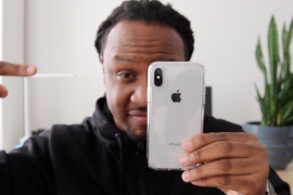 photo of host, mike, holding an iphone X