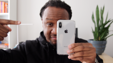 photo of host, mike, holding an iphone X